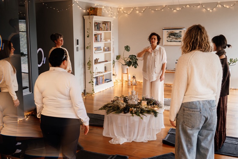 A group gathering around the altar before breathwork