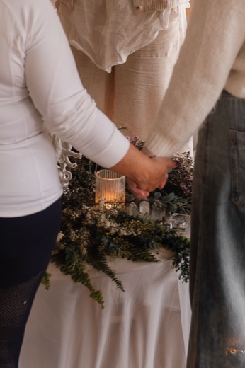 Hands held over the altar at the close of a session